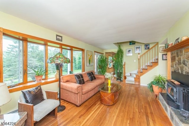 25 Mordaunt Rd, Vernon Twp, NJ 07462 - living room with a wood stove, wood finished floors, healthy amount of natural light, and stairs