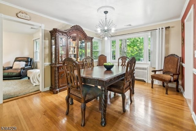 1707 Valley Rd, Long Hill Twp, NJ 07946 - dining area with radiator, a chandelier, light wood-style floors, and ornamental molding