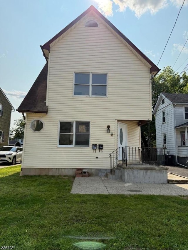 33 Fisher Ave, Bound Brook Boro, NJ 08805 - back of house featuring a yard and a patio area