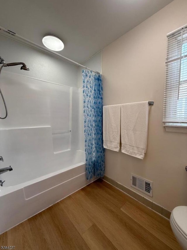 33 Fisher Ave, Bound Brook Boro, NJ 08805 - bathroom with wood finished floors and shower / tub combo