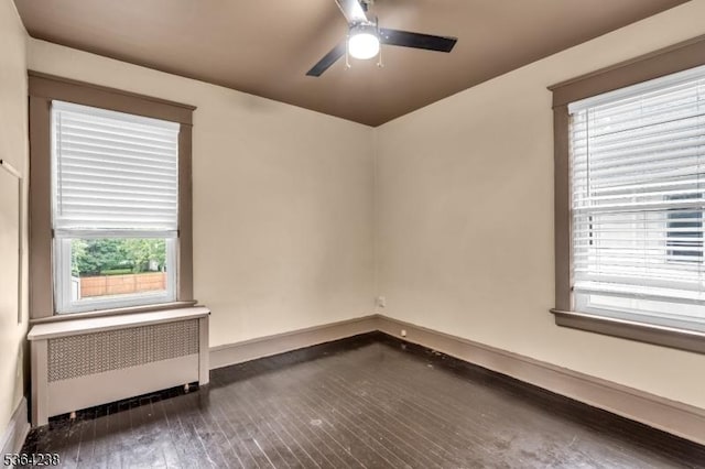 1332 Maple Ter, Rahway City, NJ 07065 - unfurnished room featuring radiator heating unit, dark wood finished floors, and ceiling fan
