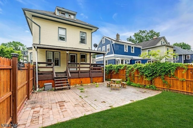 1332 Maple Ter, Rahway City, NJ 07065 - back of house featuring a fenced backyard and a patio area