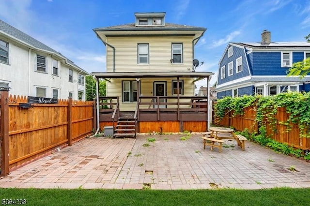 1332 Maple Ter, Rahway City, NJ 07065 - back of house with a fenced backyard and a patio