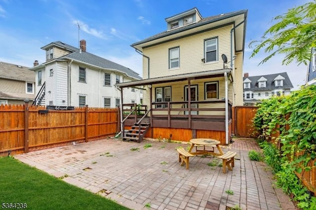 1332 Maple Ter, Rahway City, NJ 07065 - back of house featuring a hot tub, a patio, and a fenced backyard