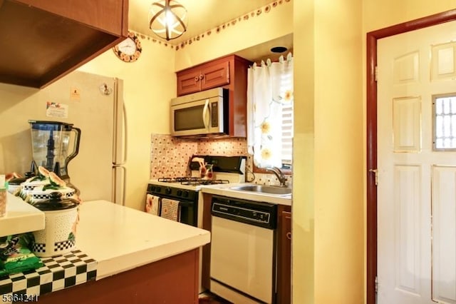 6 Essex St Unit F-32, Belleville Twp, NJ 07109 - kitchen with white appliances, light countertops, and plenty of natural light