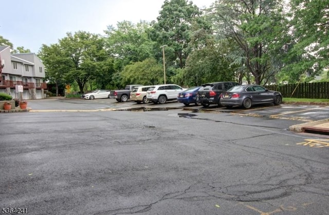 6 Essex St Unit F-32, Belleville Twp, NJ 07109 - uncovered parking lot featuring view of scattered trees