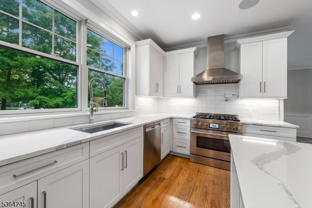 4 Hanover Rd Unit 1, Florham Park Boro, NJ 07932 - kitchen with wall chimney range hood, appliances with stainless steel finishes, crown molding, white cabinetry, and backsplash