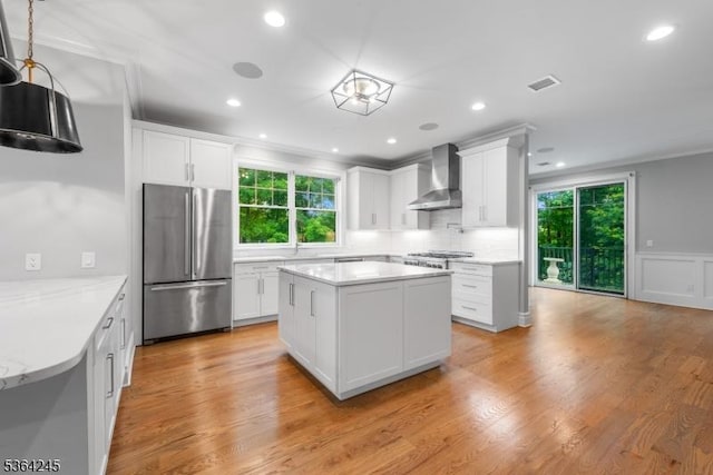 4 Hanover Rd Unit 1, Florham Park Boro, NJ 07932 - kitchen featuring appliances with stainless steel finishes, wall chimney exhaust hood, healthy amount of natural light, white cabinetry, and recessed lighting