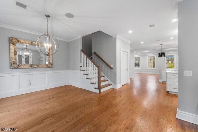 4 Hanover Rd Unit 1, Florham Park Boro, NJ 07932 - unfurnished dining area featuring crown molding, wood finished floors, a chandelier, stairs, and recessed lighting