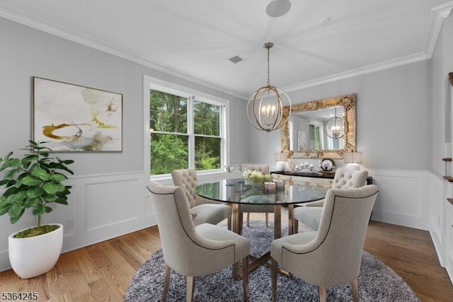 4 Hanover Rd Unit 1, Florham Park Boro, NJ 07932 - dining room featuring a chandelier, ornamental molding, wood finished floors, a decorative wall, and a wainscoted wall