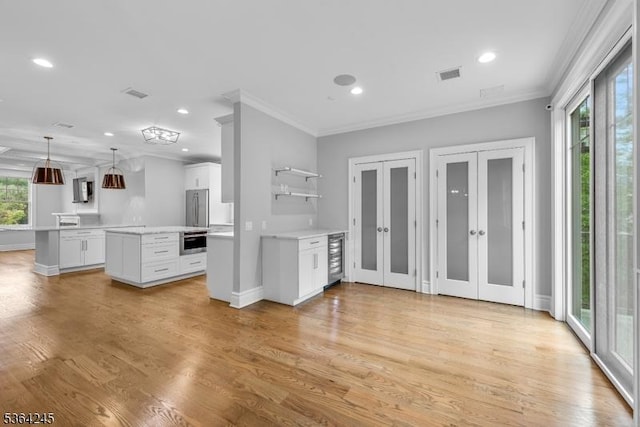 4 Hanover Rd Unit 1, Florham Park Boro, NJ 07932 - kitchen featuring a kitchen island, crown molding, french doors, light countertops, and recessed lighting
