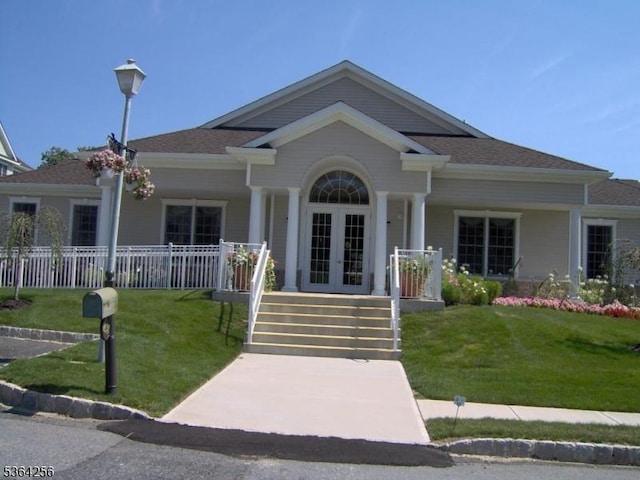 28 Ridgeview Ln, Mount Arlington Boro, NJ 07856 - view of front facade with french doors, a porch, and a front yard