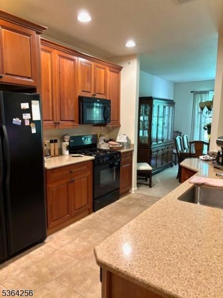 28 Ridgeview Ln, Mount Arlington Boro, NJ 07856 - kitchen with black appliances, recessed lighting, brown cabinets, and light tile patterned floors