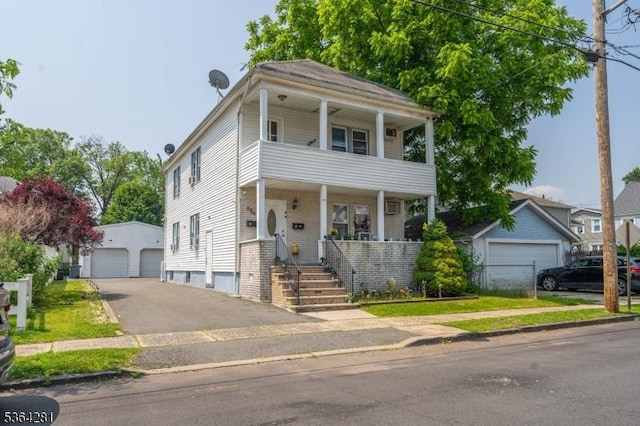 684 Harrison St, Rahway City, NJ 07065 - view of front of home featuring a garage, a balcony, an outbuilding, covered porch, and brick siding