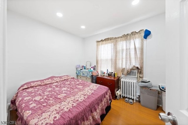 684 Harrison St, Rahway City, NJ 07065 - bedroom with radiator, wood finished floors, and recessed lighting