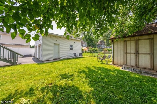 684 Harrison St, Rahway City, NJ 07065 - fenced backyard featuring a storage shed