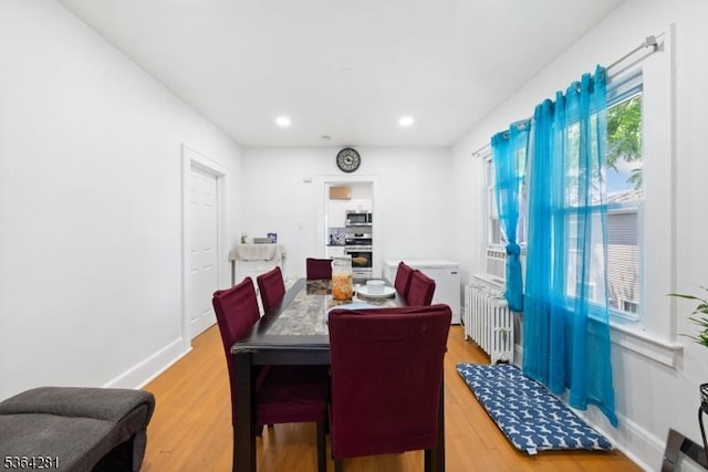 684 Harrison St, Rahway City, NJ 07065 - dining space with light wood-style floors, recessed lighting, and radiator heating unit