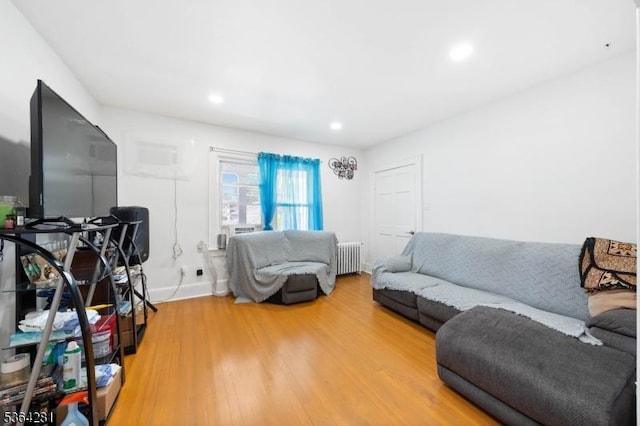 684 Harrison St, Rahway City, NJ 07065 - living room with radiator heating unit, light wood-style floors, and recessed lighting
