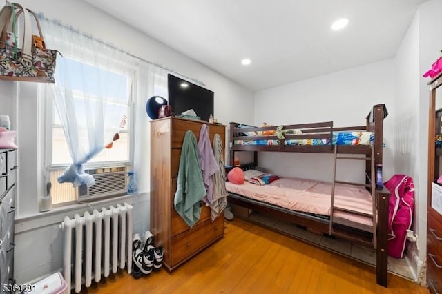 684 Harrison St, Rahway City, NJ 07065 - bedroom featuring radiator, wood finished floors, cooling unit, and recessed lighting