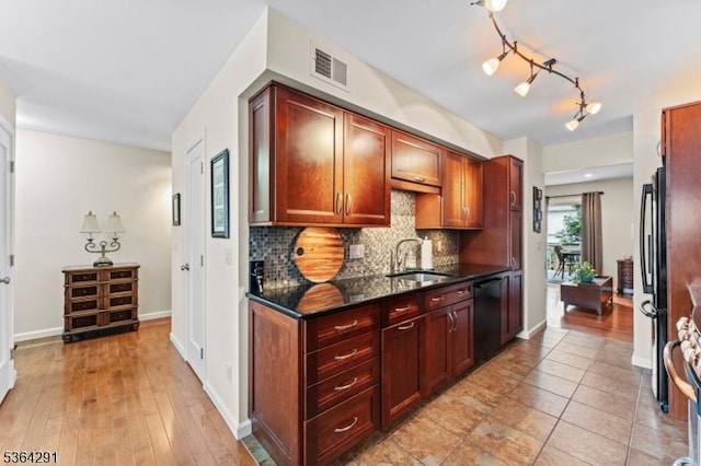 1200 Springfield Ave Unit 3A, New Providence Boro, NJ 07974 - kitchen with black appliances, tasteful backsplash, and dark stone counters