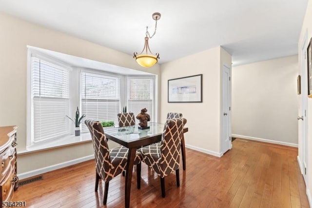 1200 Springfield Ave Unit 3A, New Providence Boro, NJ 07974 - dining space with light wood-style floors and baseboards