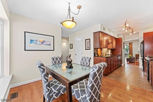 1200 Springfield Ave Unit 3A, New Providence Boro, NJ 07974 - dining space with baseboards and light wood-style flooring