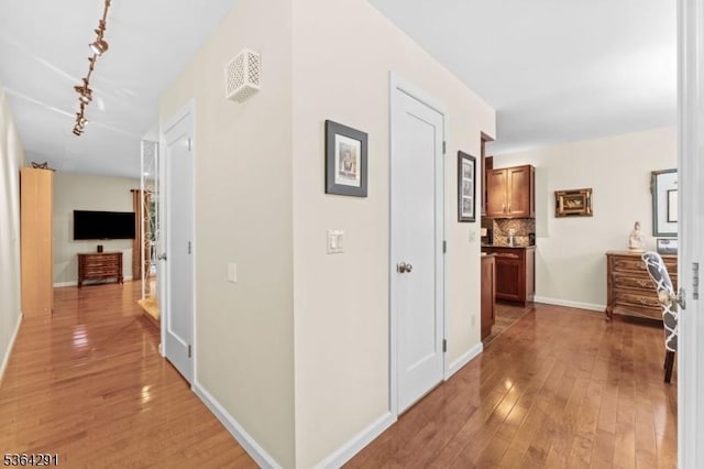 1200 Springfield Ave Unit 3A, New Providence Boro, NJ 07974 - corridor with light wood-style flooring and track lighting