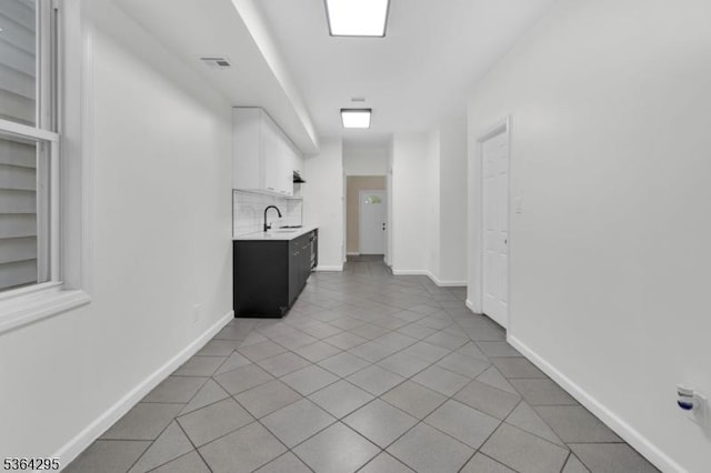 158 Catherine St Unit A/B, Elizabeth City, NJ 07201 - interior space featuring light countertops, light tile patterned flooring, white cabinetry, and open shelves