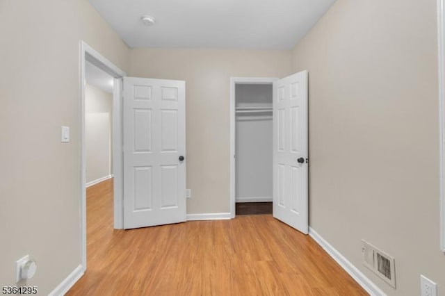 158 Catherine St Unit A/B, Elizabeth City, NJ 07201 - unfurnished bedroom featuring light wood-style flooring and a closet