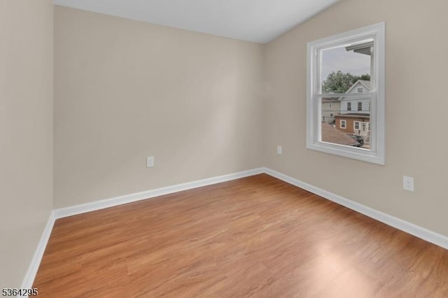 158 Catherine St Unit A/B, Elizabeth City, NJ 07201 - empty room with light wood-type flooring and lofted ceiling