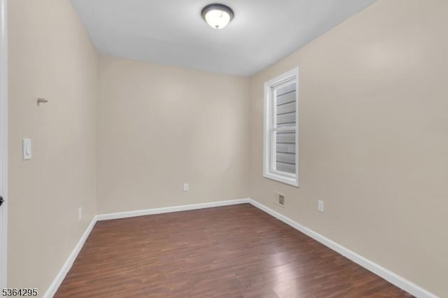 158 Catherine St Unit A/B, Elizabeth City, NJ 07201 - spare room featuring dark wood-style flooring and baseboards