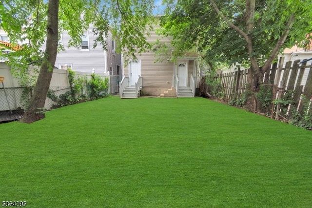 158 Catherine St Unit A/B, Elizabeth City, NJ 07201 - fenced backyard featuring entry steps