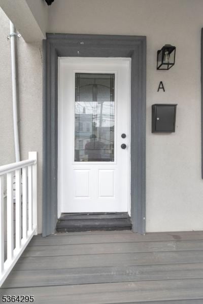 158 Catherine St Unit A/B, Elizabeth City, NJ 07201 - doorway to property featuring stucco siding