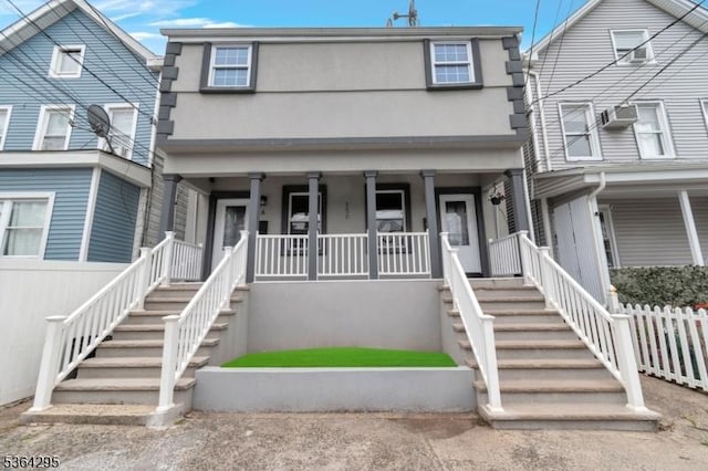 158 Catherine St Unit A/B, Elizabeth City, NJ 07201 - view of property with stucco siding, covered porch, and stairway