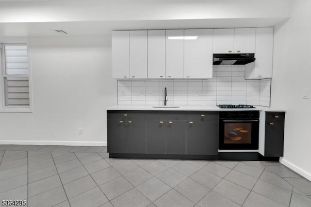 158 Catherine St Unit A/B, Elizabeth City, NJ 07201 - kitchen with black oven, range hood, light countertops, and tasteful backsplash
