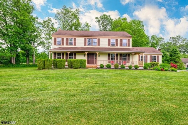 1 Warwick Dr, Washington Twp, NJ 07853 - view of front of home with a chimney, a porch, and a front lawn