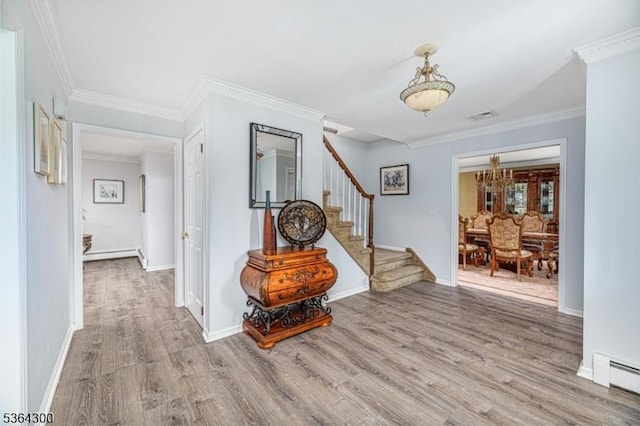 1 Warwick Dr, Washington Twp, NJ 07853 - corridor featuring baseboard heating, wood finished floors, stairway, a chandelier, and ornamental molding