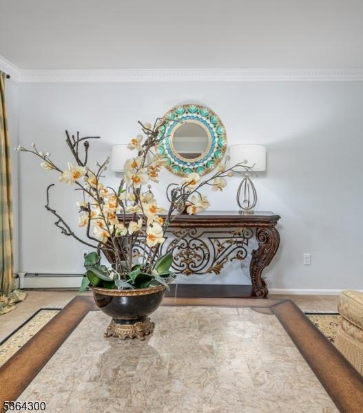 1 Warwick Dr, Washington Twp, NJ 07853 - detailed view of ornamental molding and baseboard heating