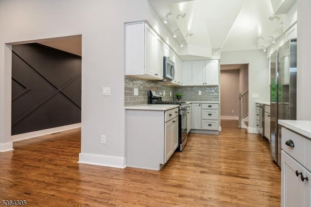 9 Somerset Pl, West Milford Twp, NJ 07480 - kitchen with appliances with stainless steel finishes, track lighting, light countertops, and light wood-type flooring
