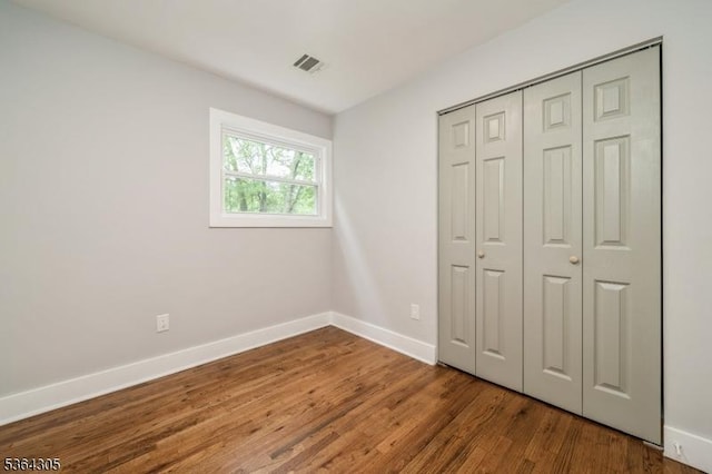 9 Somerset Pl, West Milford Twp, NJ 07480 - unfurnished bedroom with wood finished floors and a closet