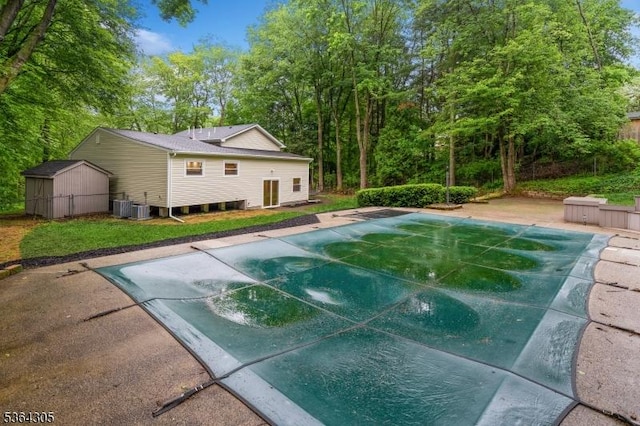 9 Somerset Pl, West Milford Twp, NJ 07480 - view of pool featuring a storage unit, a covered pool, and a patio area