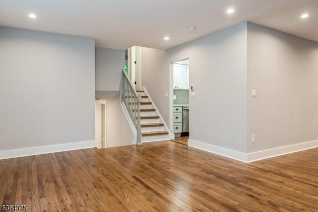 9 Somerset Pl, West Milford Twp, NJ 07480 - unfurnished living room featuring stairs, wood finished floors, and recessed lighting