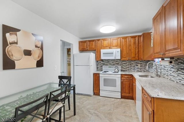 322 Richard Mine Rd Unit H3, Rockaway Twp, NJ 07885 - kitchen with white appliances, tasteful backsplash, and brown cabinets