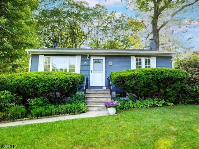 23 Felter Pl, Jefferson Twp, NJ 07849 - view of front of property featuring a front yard and a chimney
