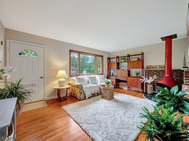 23 Felter Pl, Jefferson Twp, NJ 07849 - living room with a wood stove and light wood-type flooring