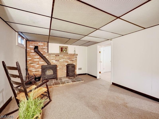 23 Felter Pl, Jefferson Twp, NJ 07849 - below grade area with a wood stove and carpet flooring