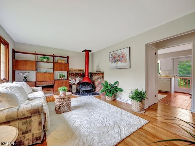 23 Felter Pl, Jefferson Twp, NJ 07849 - living room with a wood stove and wood finished floors