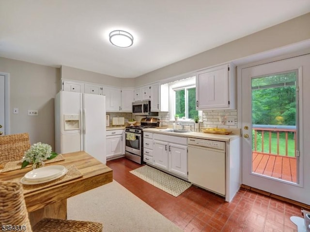 23 Felter Pl, Jefferson Twp, NJ 07849 - kitchen with stainless steel appliances, backsplash, light countertops, and white cabinetry