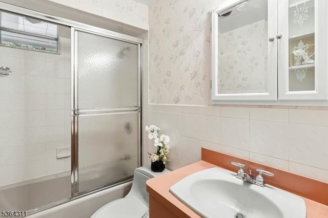 2242 Shawnee Path, Scotch Plains Twp, NJ 07076 - bathroom with wallpapered walls, vanity, and bath / shower combo with glass door