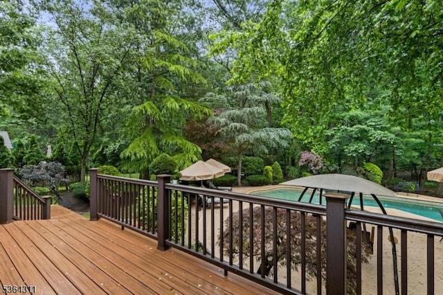 2242 Shawnee Path, Scotch Plains Twp, NJ 07076 - deck featuring an outdoor pool and view of wooded area